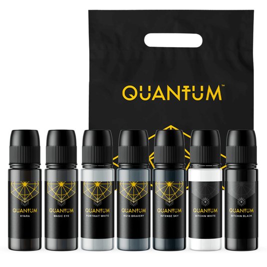 Set of Quantum ink jbottles with a black bag featuring the Quantum logo on a white background.